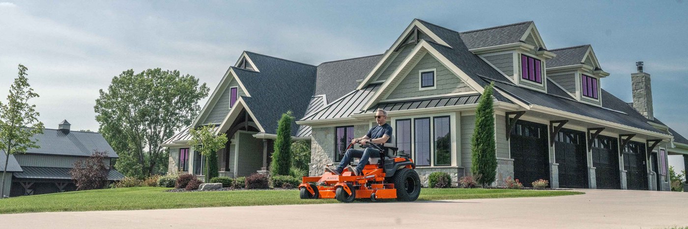 Ariens APEX zero-turn mower cutting an open lawn